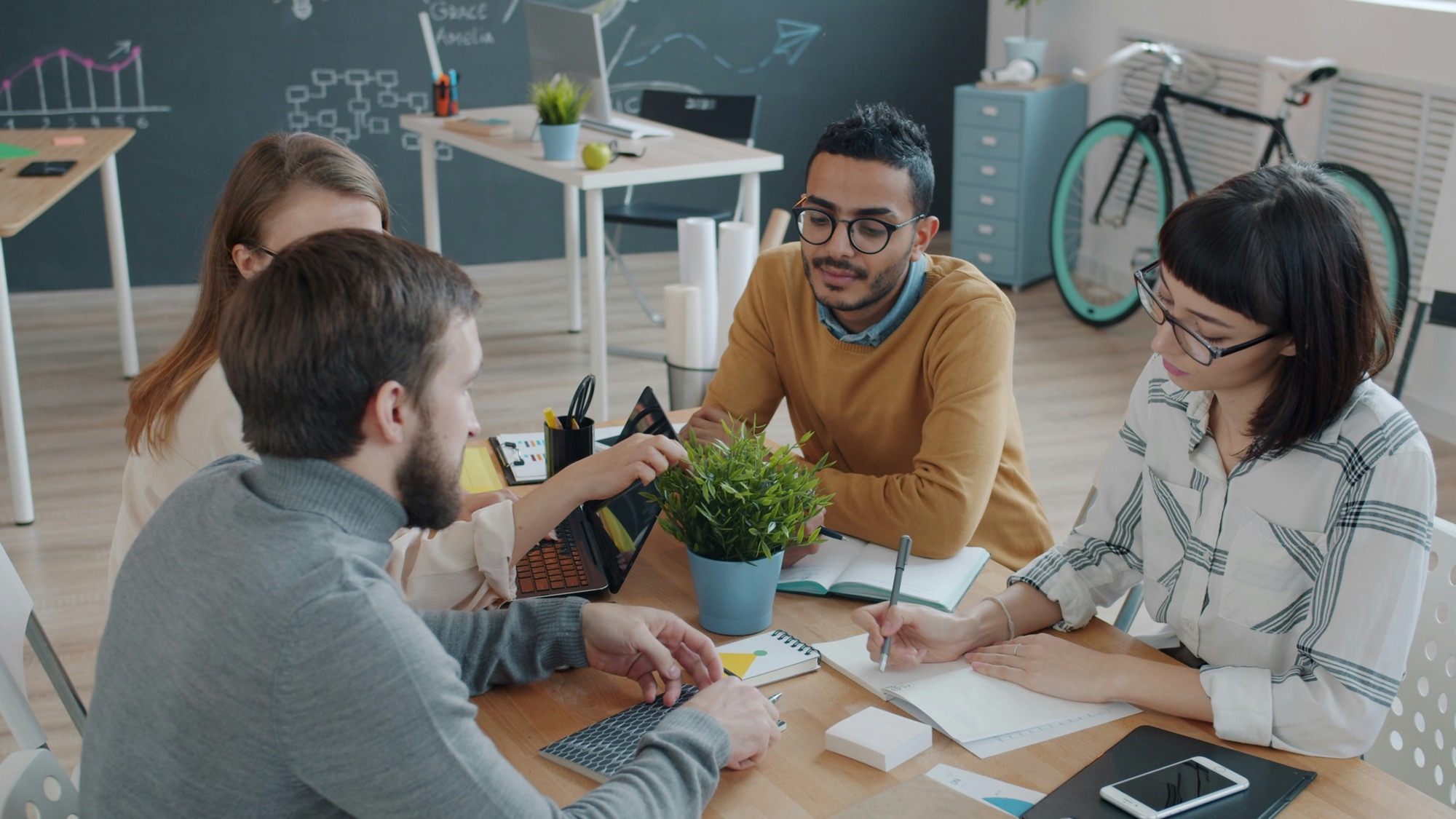 Diverse colleagues collaborating around a table