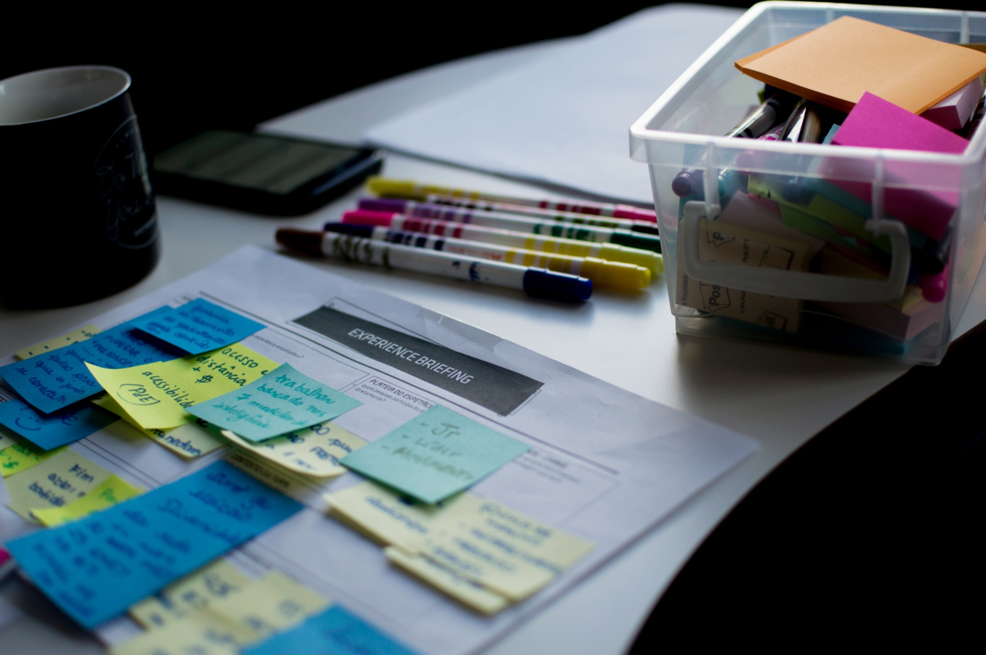 Sticky notes and paperwork on a desk